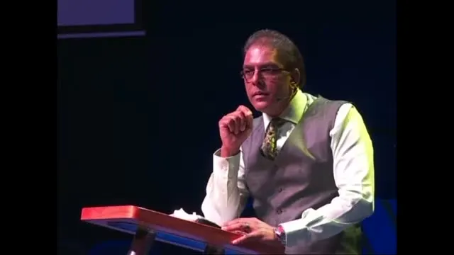Dr RJ Sing at the pulpit in a waistcoat, 2014